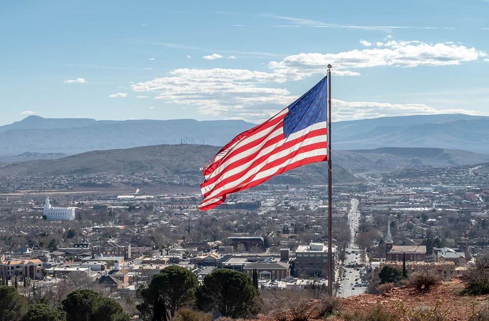 Flag of the United States over cityscape