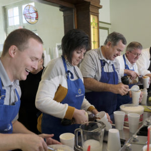 People serving ice cream