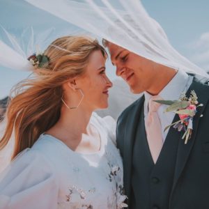 man and woman in wedding clothing