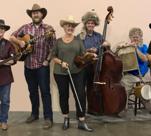 6 people standing with instruments