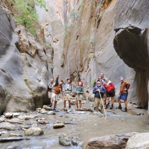 People pointing at canyon walls